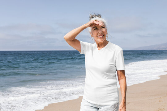Senior woman enjoying at the summer beach