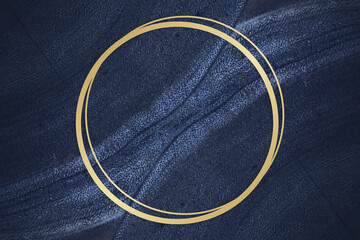 Golden framed circle on a blue textured stone