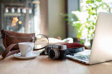 digital journalist's desk with technological elements, such as camera and laptop computer.