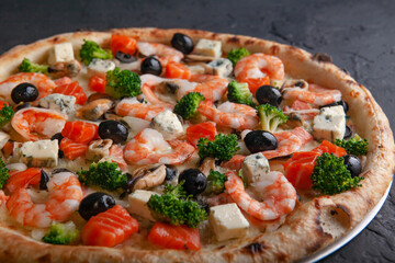fresh italian pizza on black background