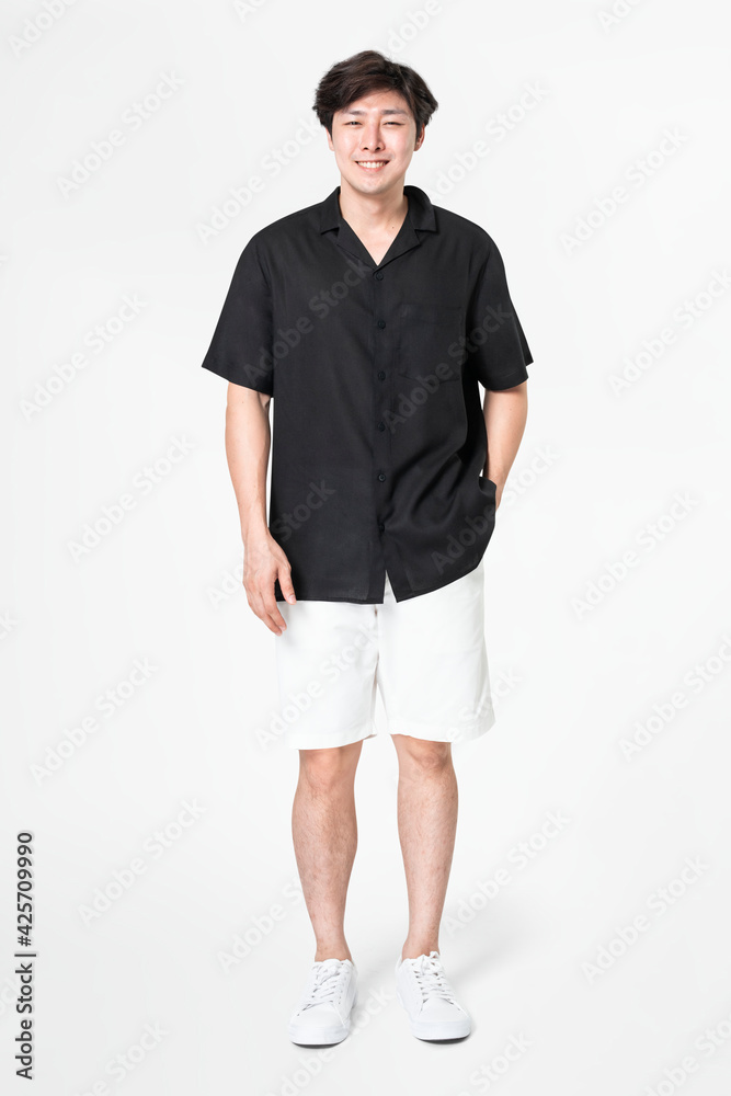 Wall mural Man in black shirt and shorts with design space casual wear fashion full body - Wall murals