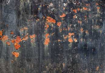 black metal surface with peeling paint and rusty spots - steampunk dirty background