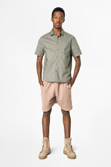 African American man in gray shirt and shorts casual wear fashion