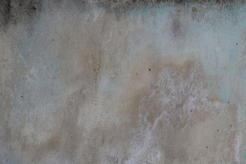 wet and dirty wall with different tones, textures and colors of moisture, with irregular forms in the surface - weathered background