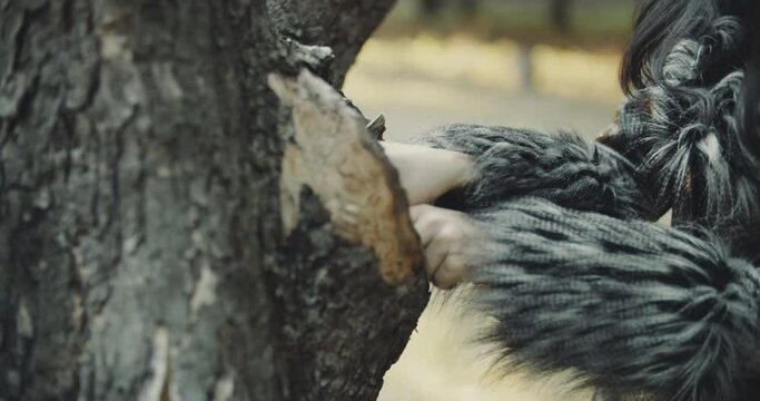 View of brunette woman found ancient parchment in a tree hole, gothic style