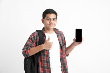Indian college student showing mobile screen on white background.