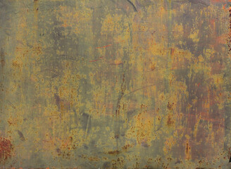 rusty metal discolored surface with yellow, green and gray natural tones - worn background with scratches and lichens for a wallpaper