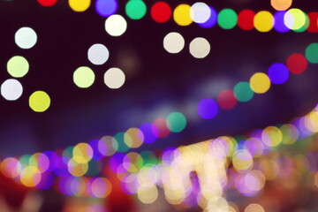 The luminous rays from the lanterns are multicolored, from the bokeh effect of the photo lens