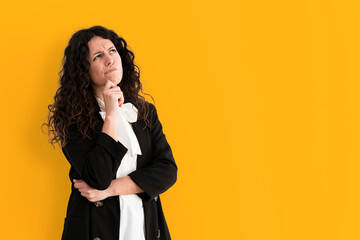 Portrait of a girl reflecting on colorful background - Pensive woman in business clothes with copy...
