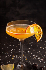 beautifully decorated alcoholic cocktail in studio on black background