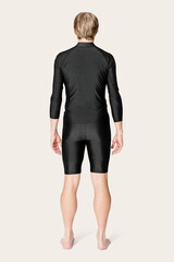 Fototapeta premium Mature man in black rash guard and shorts swimwear fashion rear view