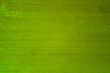 Scratched plywood sheet painted green.Texture or background