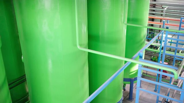 Green chemical tanks, huge barrels of chemicals, polyol containers