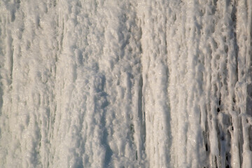 Natural view of icicles from a waterfall in abstract pattern form 