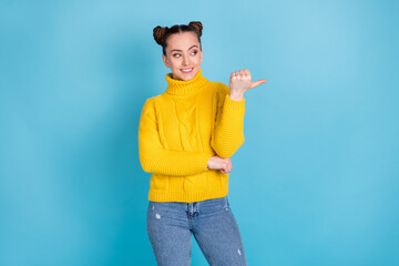 Portrait of attractive cheerful girl demonstrating copy space ad select idea isolated over bright...