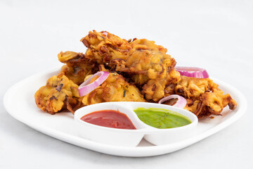 Most Enjoyed Indian Street Food With Various Names Like Onion Bhajji Pyaj Pakora Or Pakore Pyaaj Ke Pakode Or Pakoda Kanda Bhaji Pyaaz Bajji Served With Chutney And Sauce Is Tea Time Chaat Snacks © Rangeecha