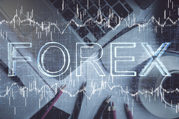 Double exposure of financial chart drawing over table background with computer. Concept of research and analysis. Top view.