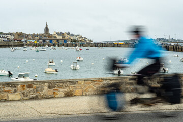 A heavily packed cyclist arriving in Roscoff, France, after a long journey 