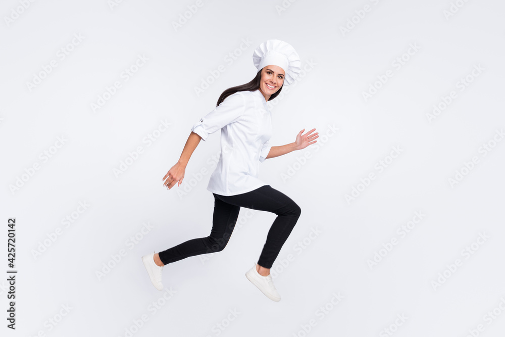 Wall mural full size profile photo of energetic cheerful lady running look camera isolated on white color backg