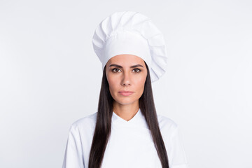Photo of young calm person look attentively camera wear cooking cap isolated on white color background