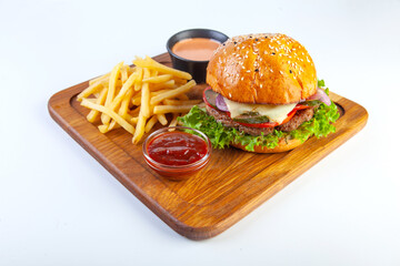 juicy hamburger on a white plate in the studio
