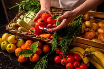 Assortment of fresh vegetables and fruits on wooden table