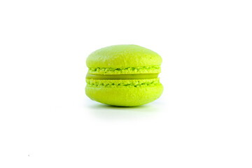 colored fresh macarons in studio on white background