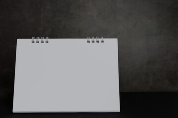 Blank calendar on a dark background.