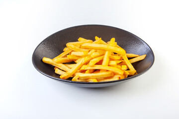 fried potatoes on a plate in the studio