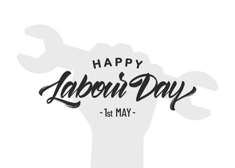 Silhouette of clenched fist with wrench, hand lettering of Happy Labour Day 1st of May