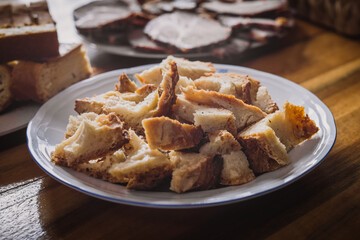 Chunks or chops of bread wrapped around ham, leftovers from easter celebration