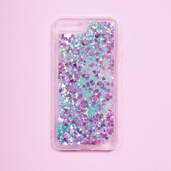 Glitter liquid phone case back view isolated on pink background. Clear phone case mockup, glitter...