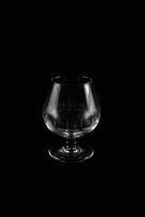 Crystal glass cup isolated against black background