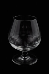 Crystal glass cup isolated against black background