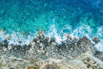 Beautiful Beach With Golden Sand And Clear Water. Turquoise coast with blue water and golden sand in Europe aerial drone photo