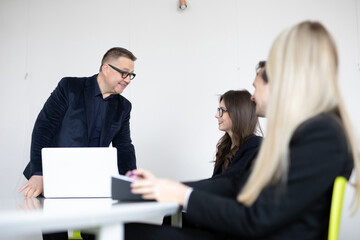 Businessteam discussing together in conference room during meeting at office