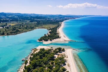 Beautiful Beach With Golden Sand And Clear Water. Turquoise coast with blue water and golden sand in Europe aerial drone photo