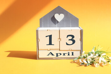 Calendar for April 13: cubes with the numbers 0 and 13, the name of the month of April in English,...