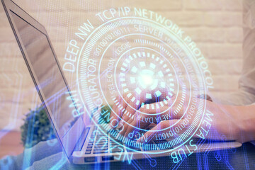 Double exposure of woman hands working on computer and data theme hologram drawing. Tech concept.