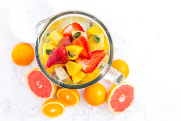Variation of fruits in mixer. Preparing milkshake or smoothie
