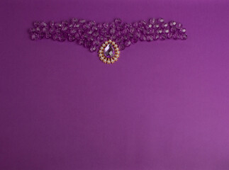 purple beads on a purple background.