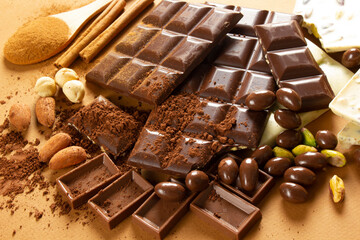 White and milk chocolates. Almond, pistachio, hazelnut.. background, texture..