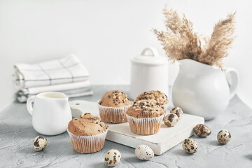 Easter sweet homemade cupcake and quail eggs. Greeting card. Festive food. Table with treats. Homemade cakes and desserts