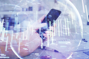 Double exposure of man's hands holding and using a phone and international business theme drawing.