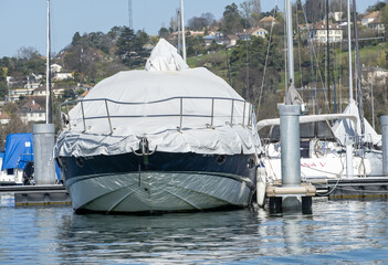 boats and yachts with a tarpaulin anchored in Lake Geneva Switzerland