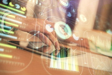 Double exposure of data theme hologram drawing and man and woman working together holding and using a mobile device.