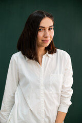 women in white robe on the green background