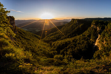 Obraz premium Spring sunrise in Salt De Coromina waterfall, La Garrotxa, Spain