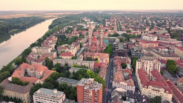 Cinematic aerial drone flyover dolly shot of Szeged, a charming historical European city on the banks of the Tisza river on the Southern Great Plane of Hungary