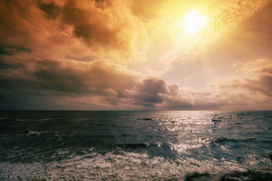 Seascape in the early morning. Dramatic sunrise over the sea. Nature landscape